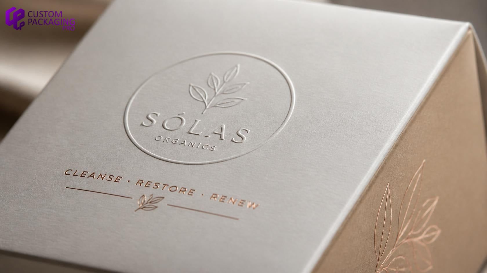 Close-up of blind embossed white packaging box with raised 3D logo texture Close-up of blind embossed white packaging box with raised 3D logo texture